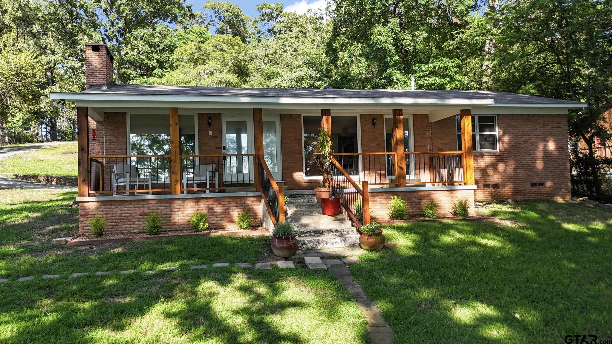 18392 Eastside Road Troup, TX 75789 - Photo 2 of 19 a view of a house with backyard sitting area and garden