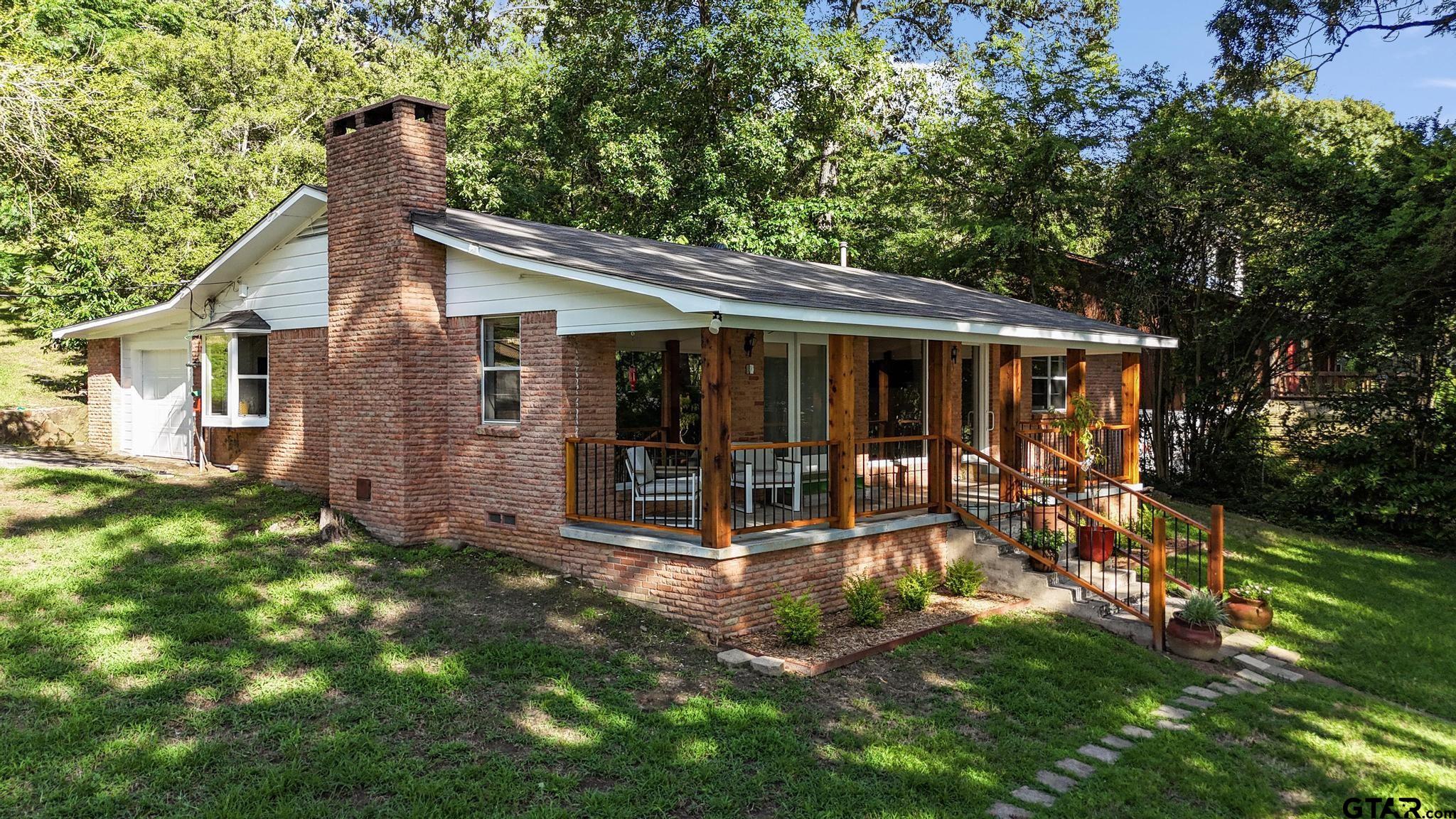 18392 Eastside Road Troup, TX 75789 - Photo 3 of 19 a view of a house with backyard porch and sitting area
