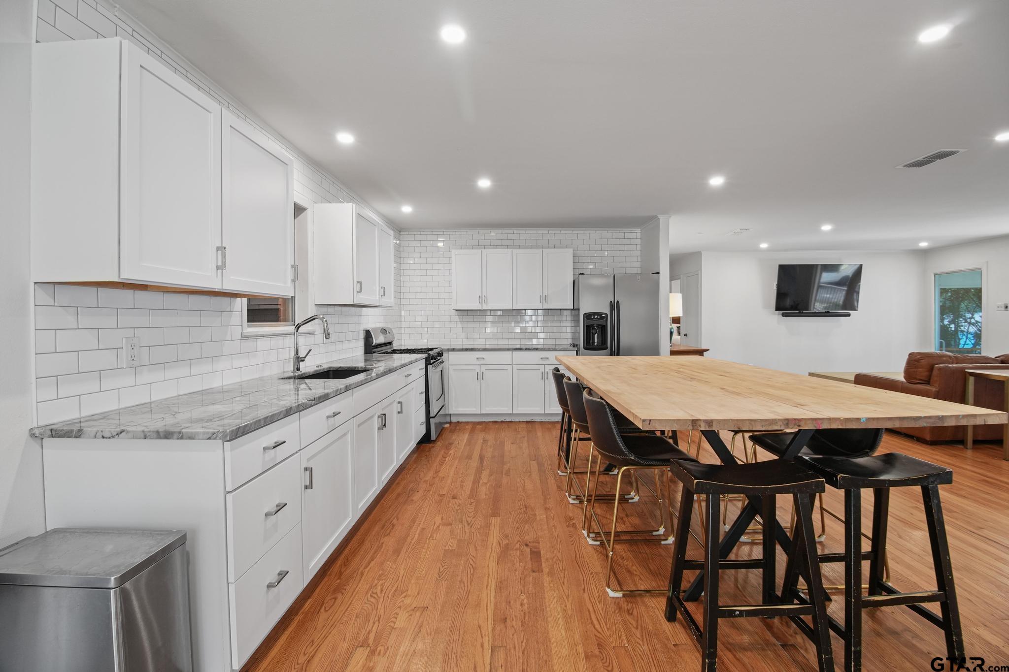 18392 Eastside Road Troup, TX 75789 - Photo 6 of 19 a large kitchen with a table and chairs in it
