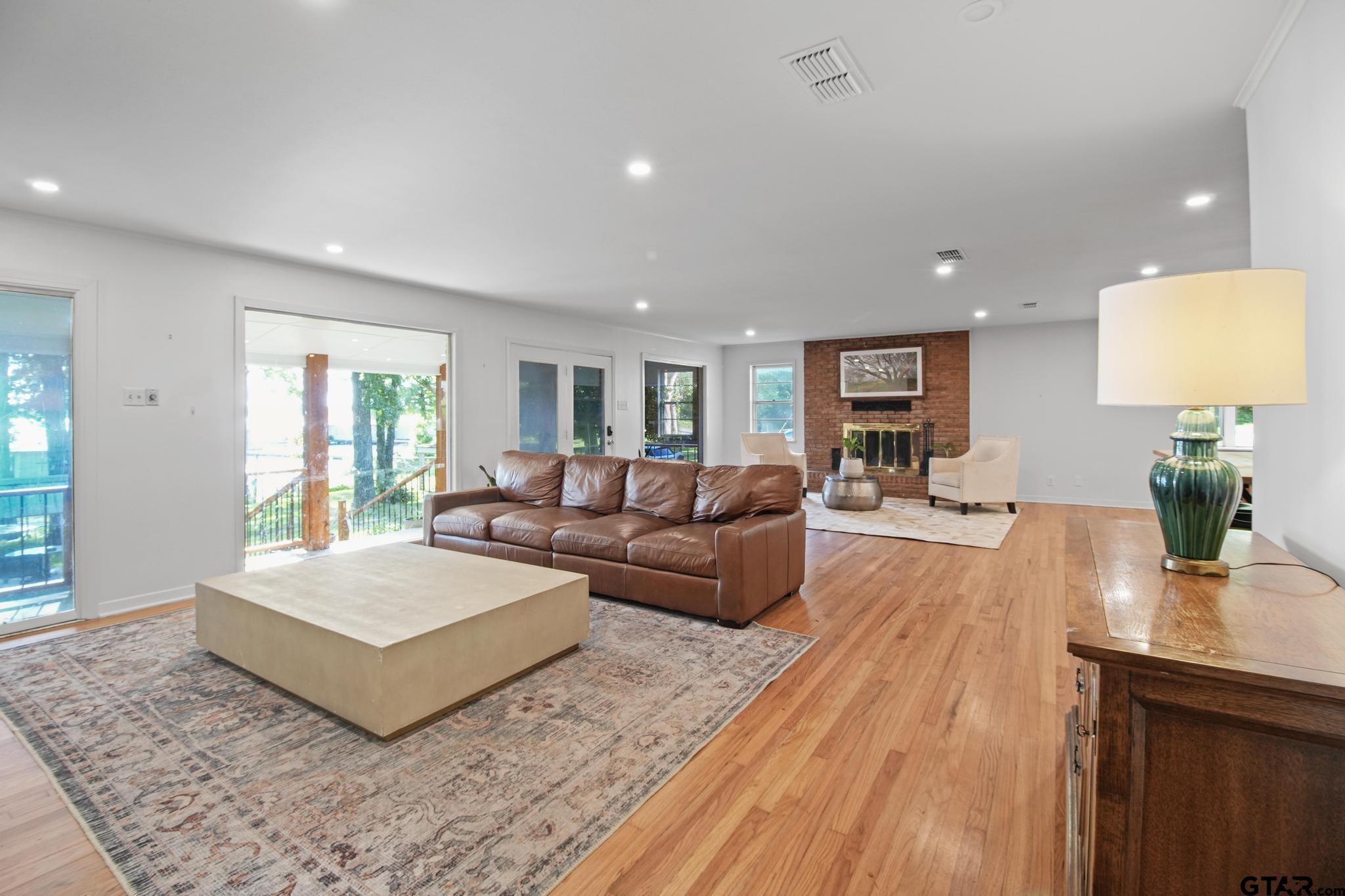 18392 Eastside Road Troup, TX 75789 - Photo 7 of 19 a living room with furniture and a wooden floor