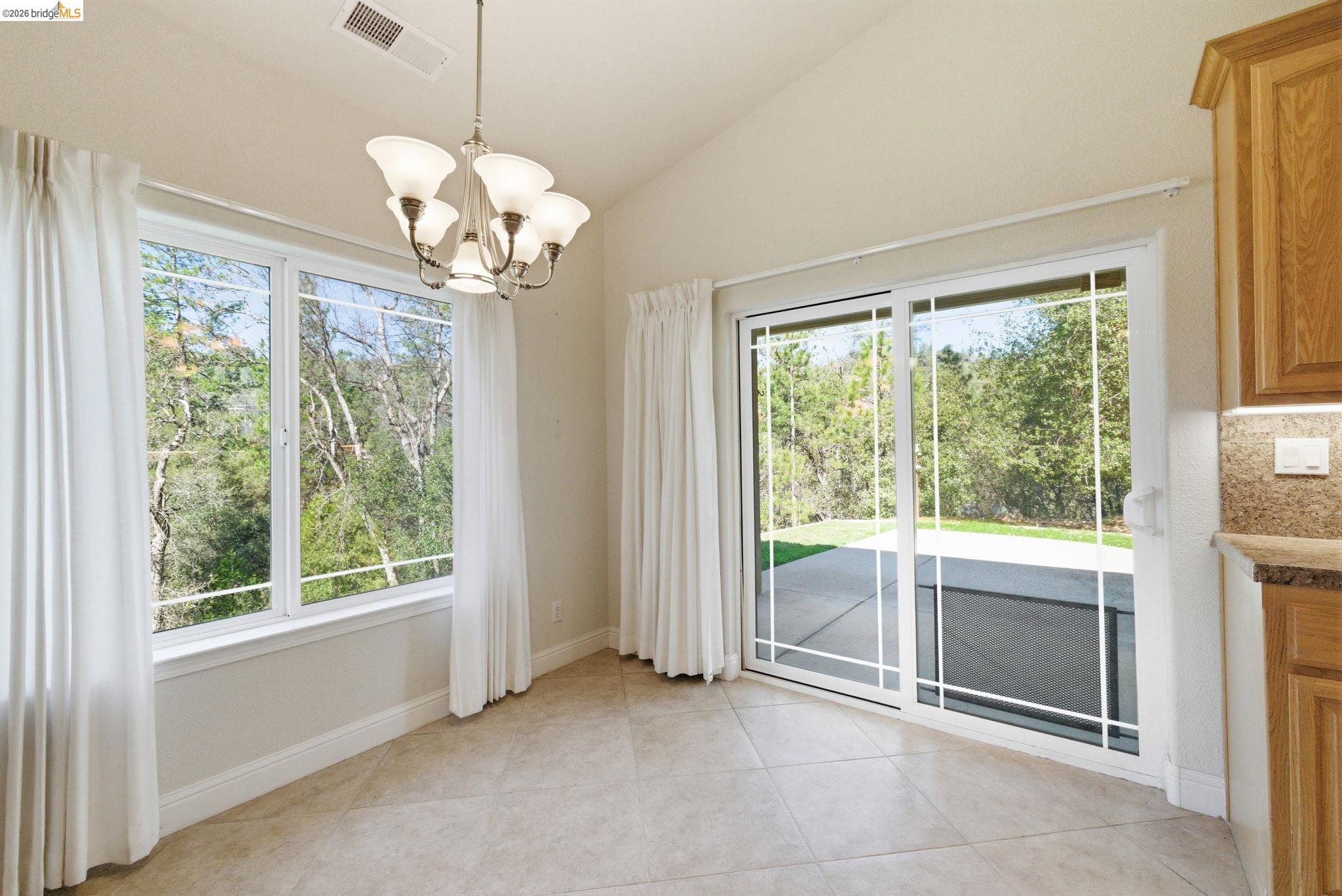 20245 Tuolumne Road North Tuolumne, CA 95379 - Photo 12 of 43 a view of a chandelier and window