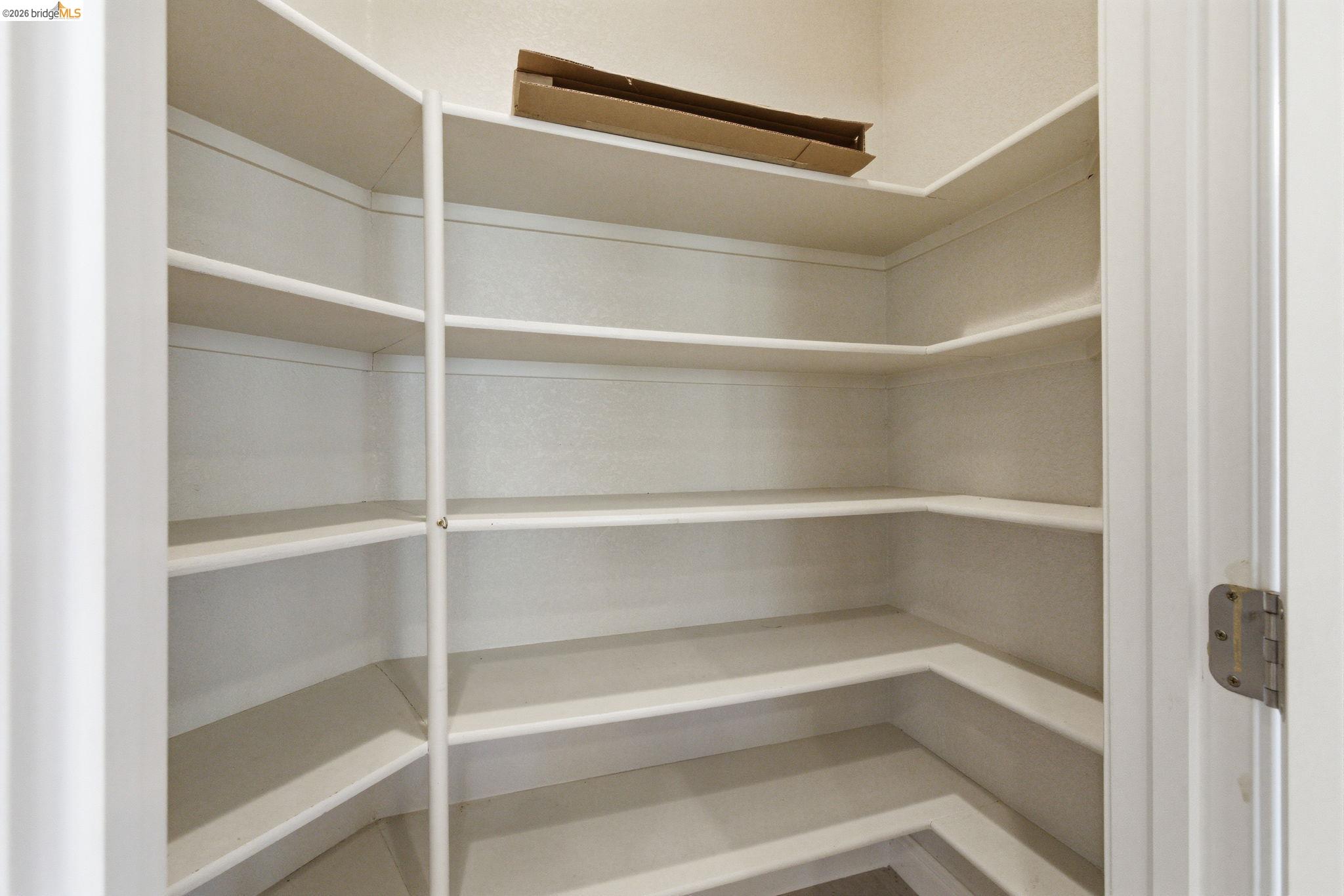 20245 Tuolumne Road North Tuolumne, CA 95379 - Photo 18 of 43 a view of walk in closet with empty racks