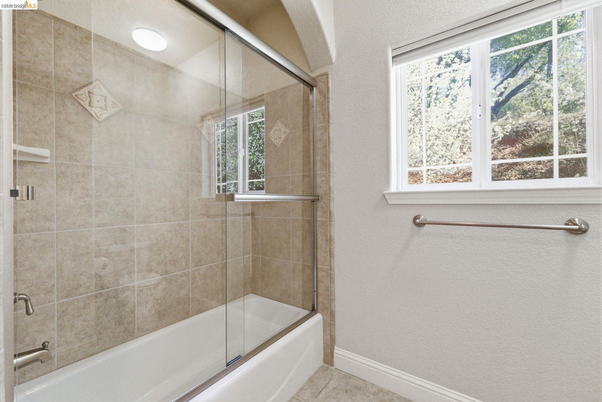 20245 Tuolumne Road North Tuolumne, CA 95379 - Photo 26 of 43 a bathroom with a shower and a bathtub