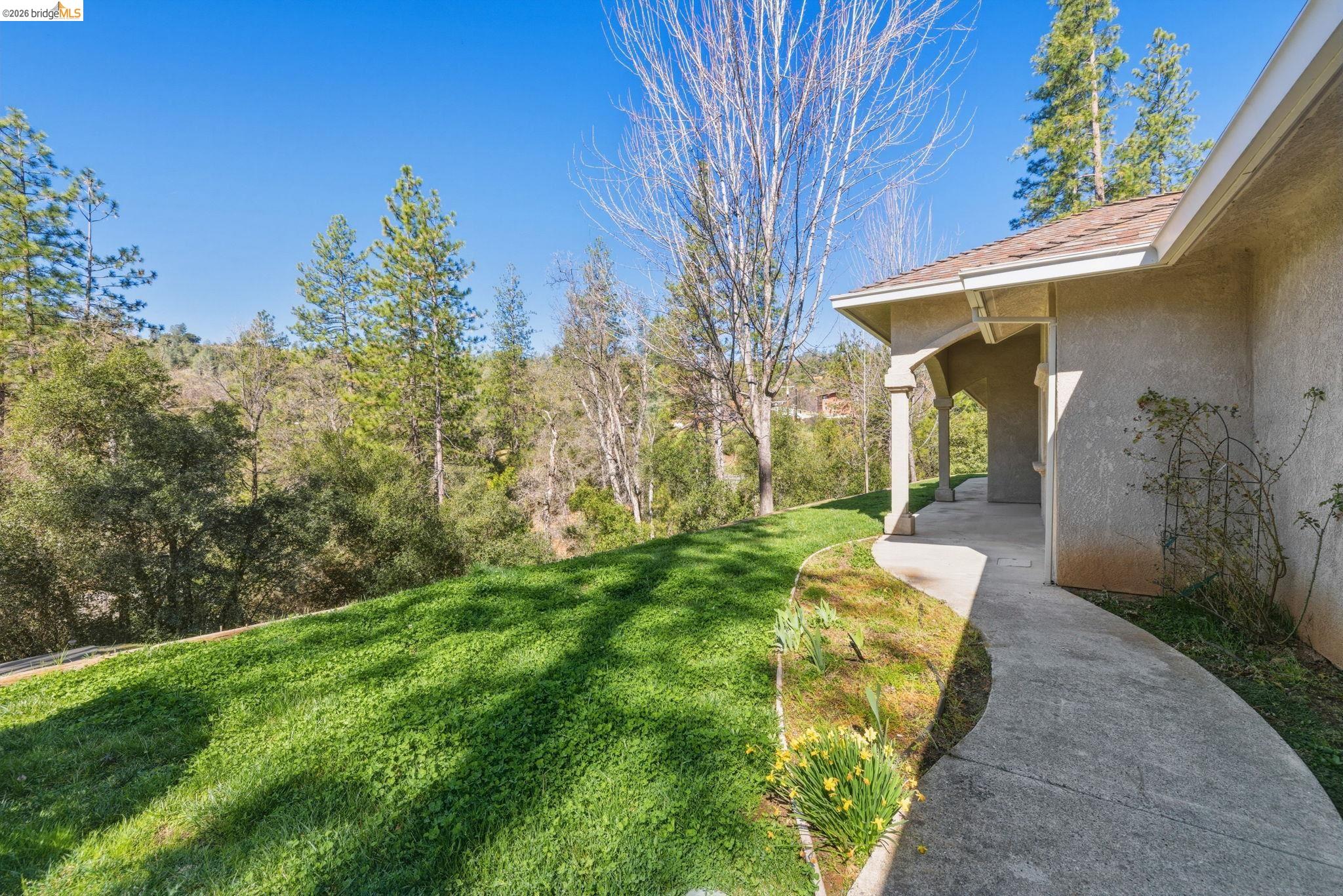 20245 Tuolumne Road North Tuolumne, CA 95379 - Photo 3 of 43 a view of a house with a yard