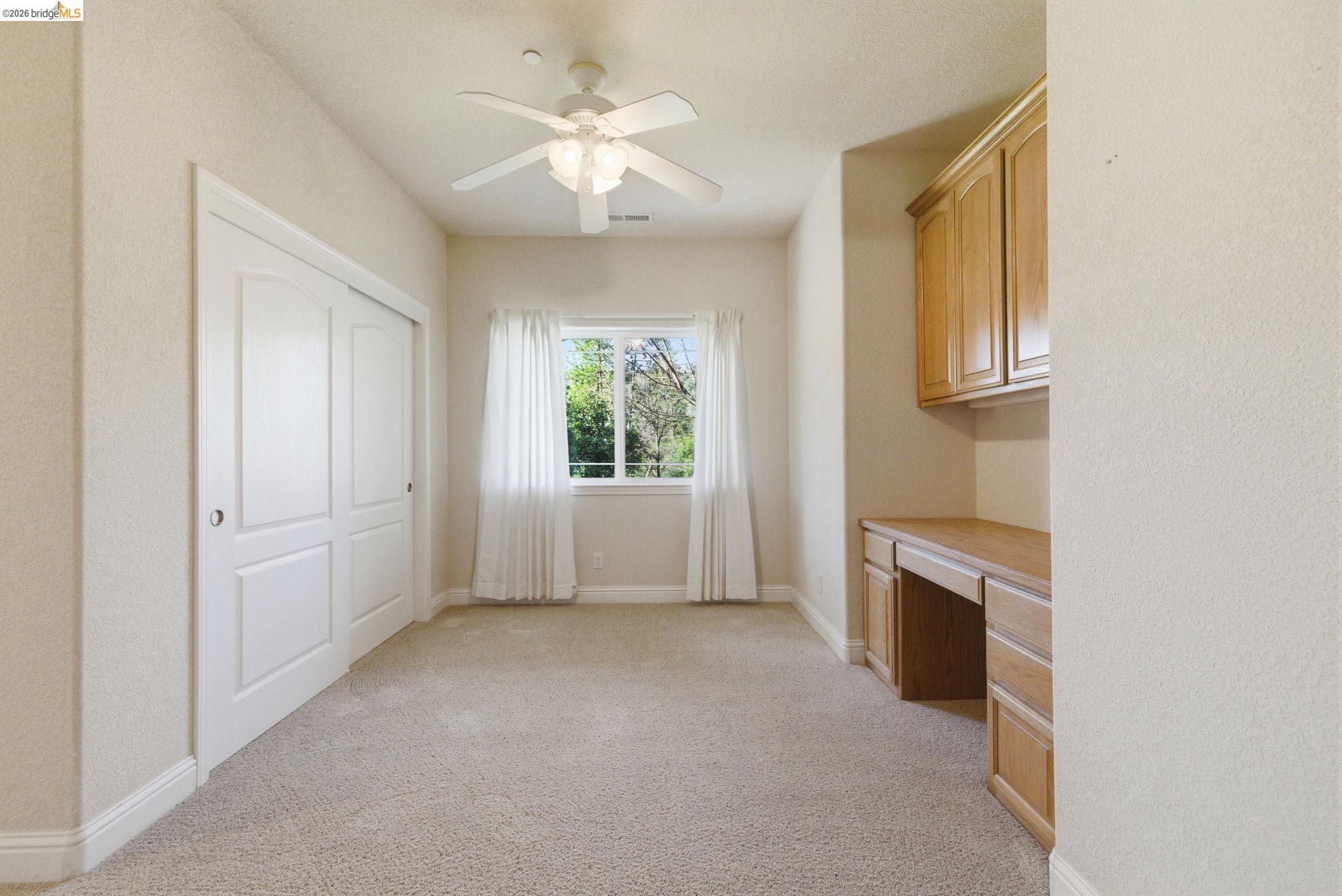 20245 Tuolumne Road North Tuolumne, CA 95379 - Photo 33 of 43 an empty room with windows