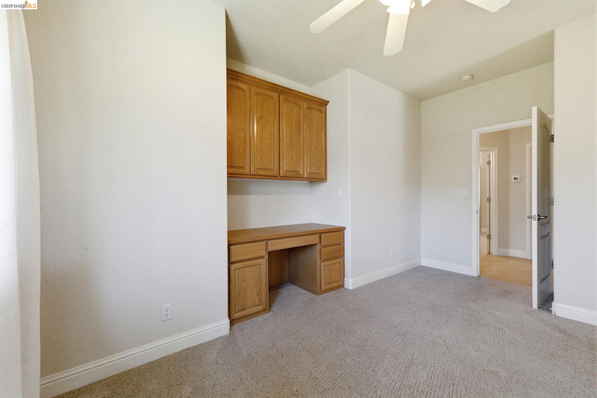 20245 Tuolumne Road North Tuolumne, CA 95379 - Photo 36 of 43 a view of an empty room with a fireplace