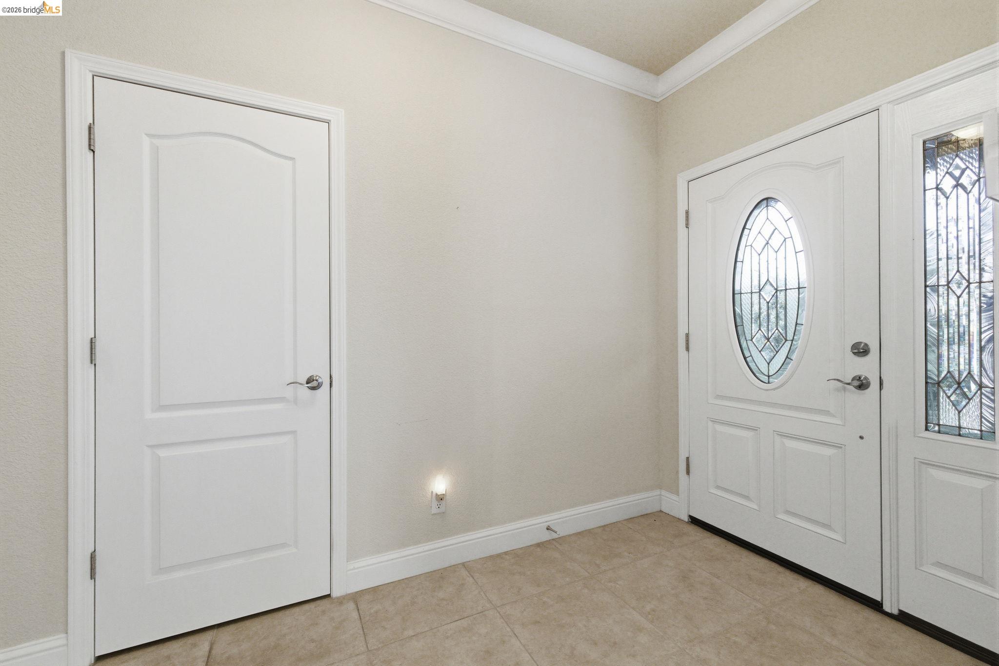 20245 Tuolumne Road North Tuolumne, CA 95379 - Photo 38 of 43 an entryway with wooden floor mirror and a window