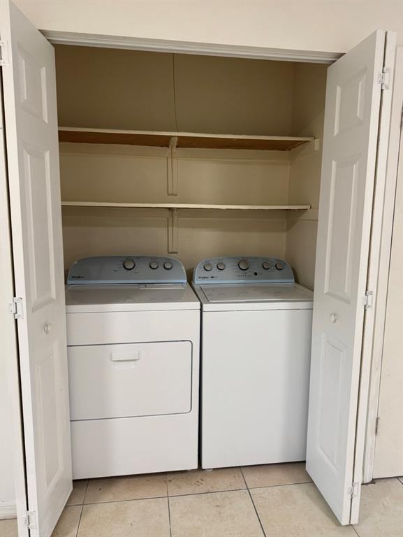 910 Wagner Place, Unit 3 Fort Pierce, FL 34982 - Photo 11 of 11 a utility room with dryer and washer