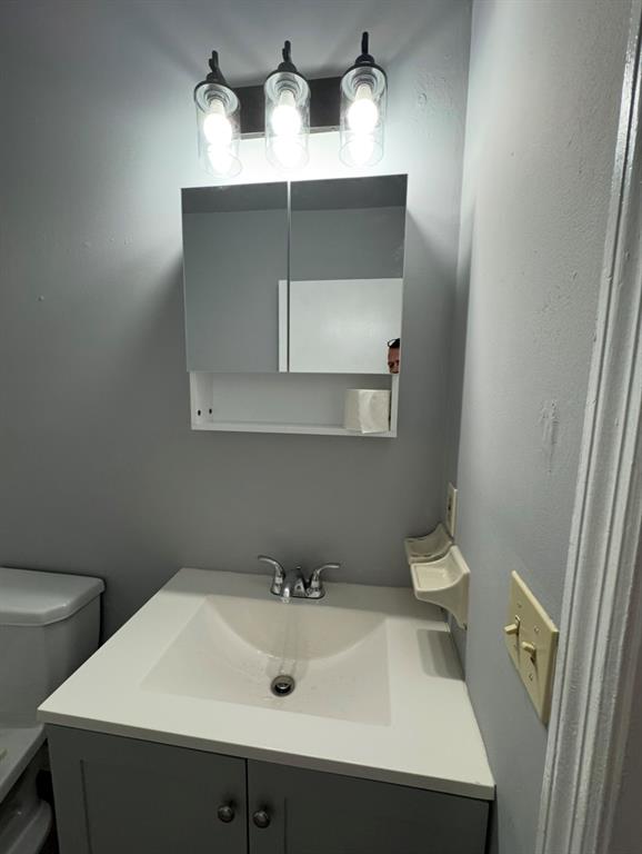 910 Wagner Place, Unit 3 Fort Pierce, FL 34982 - Photo 9 of 11 a bathroom with a sink and a toilet