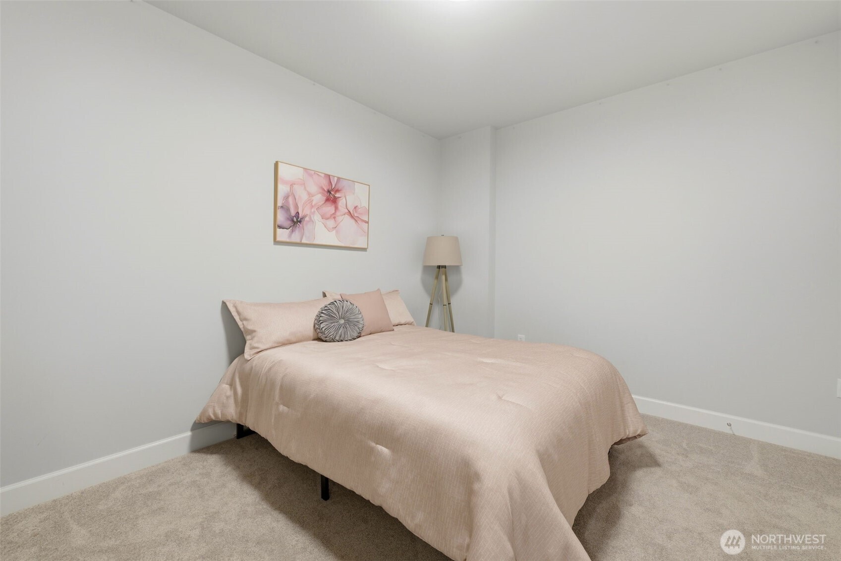 4907 Main Street, Unit 214 Tacoma, WA 98407 - Photo 16 of 34 a bedroom with a bed and a wall painting