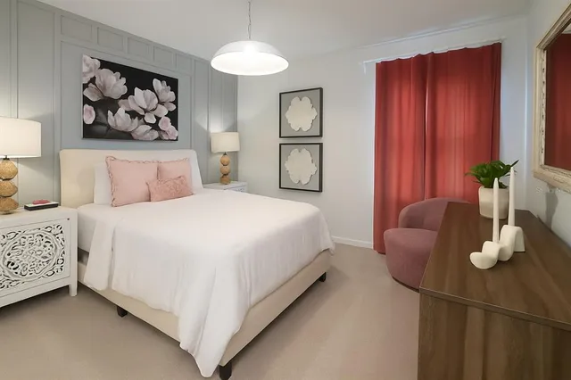 a bedroom with a bed and painting on the wall