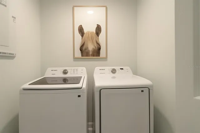 a utility room with dryer and washer