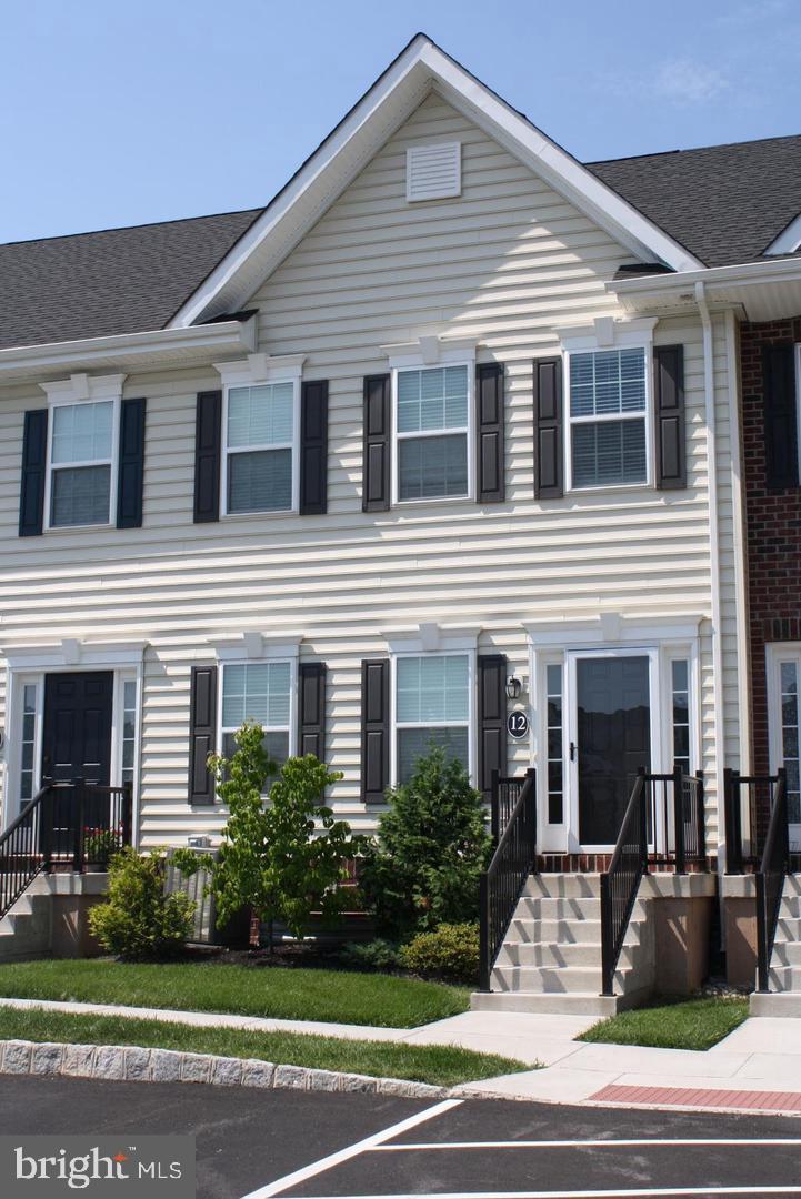 Charming townhouse with inviting curb appeal.