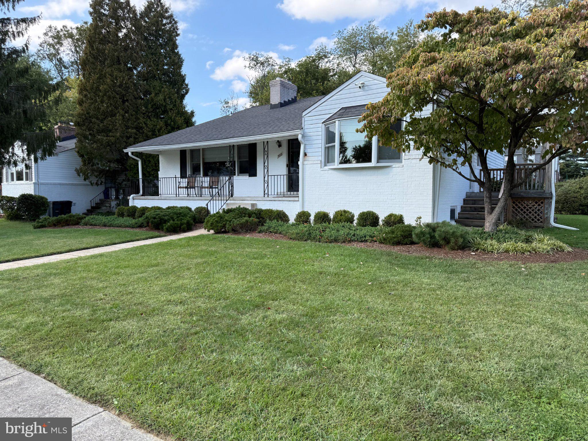 3102 Hatton Road Baltimore, MD 21208 - Photo 2 of 14 Charming home with lush green lawn.