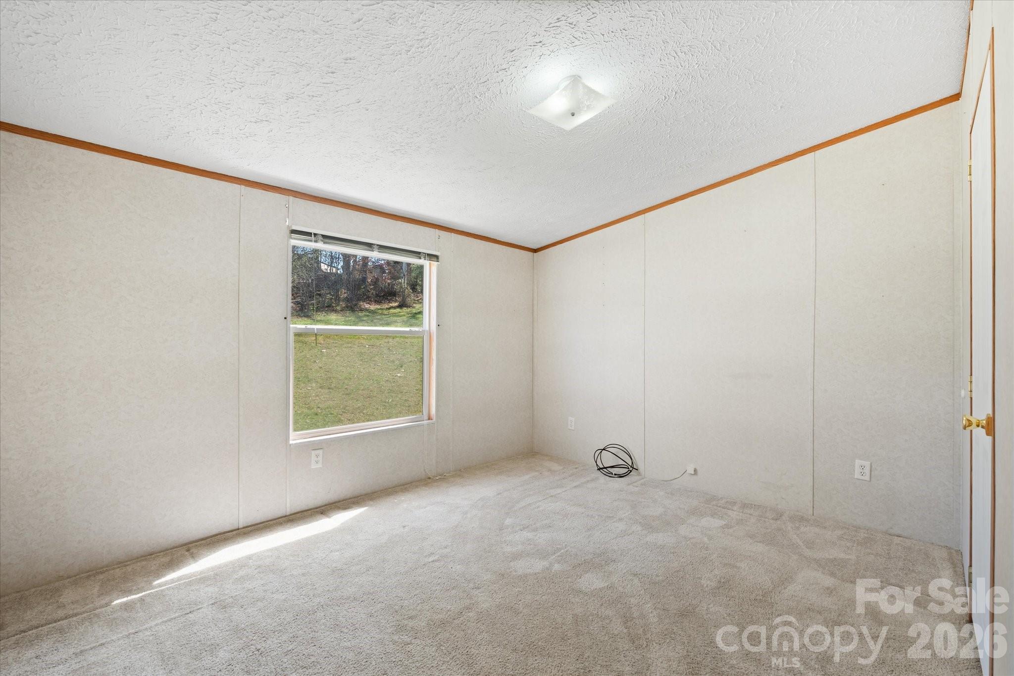 18 Ford Valley Road Weaverville, NC 28787 - Photo 14 of 37 a view of an empty room with a window