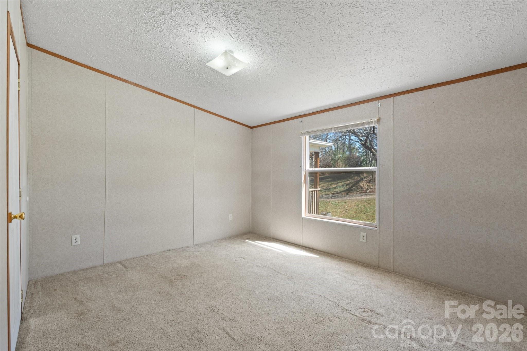 18 Ford Valley Road Weaverville, NC 28787 - Photo 15 of 37 a view of an empty room with a window