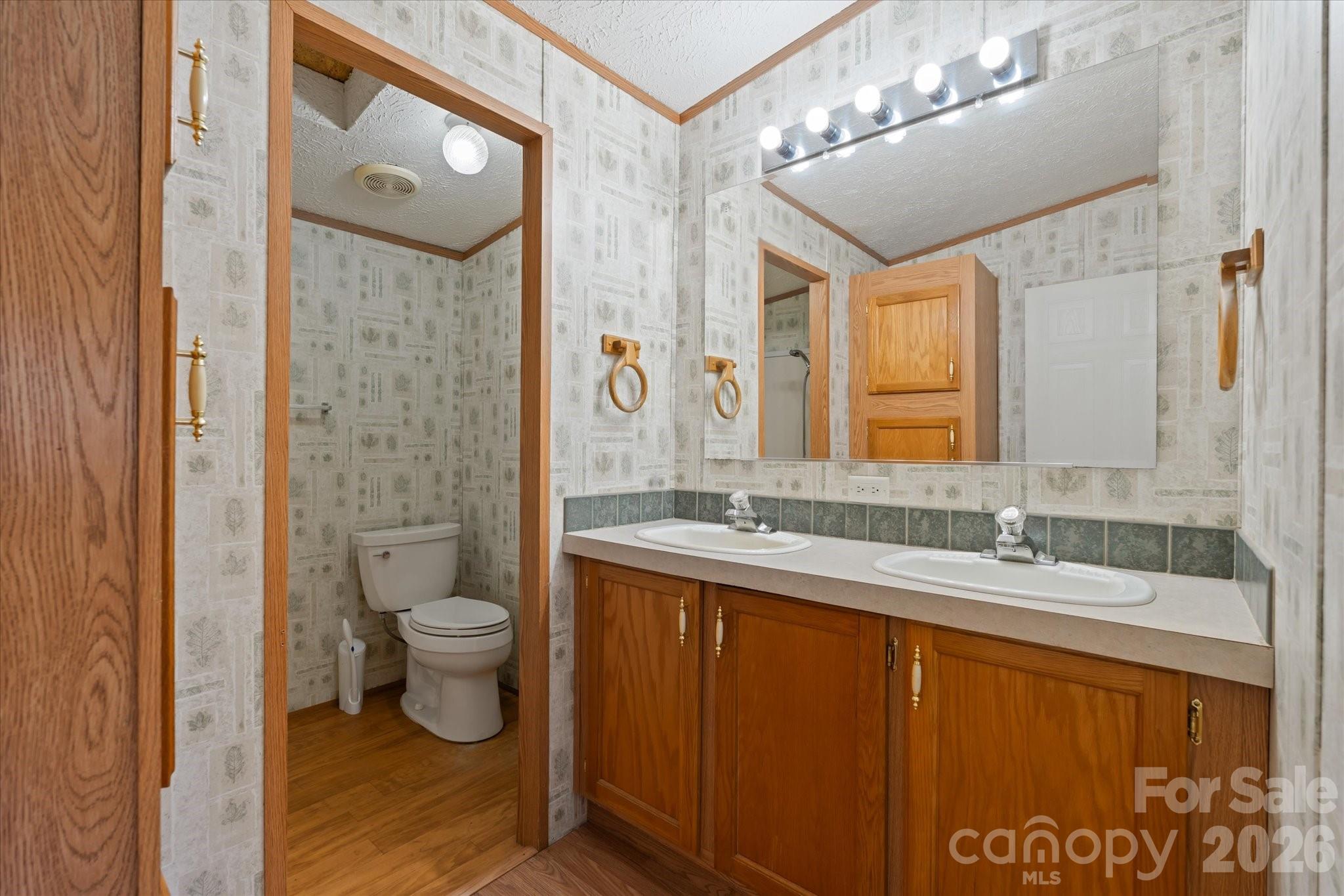 18 Ford Valley Road Weaverville, NC 28787 - Photo 16 of 37 a bathroom with a granite countertop sink toilet and shower