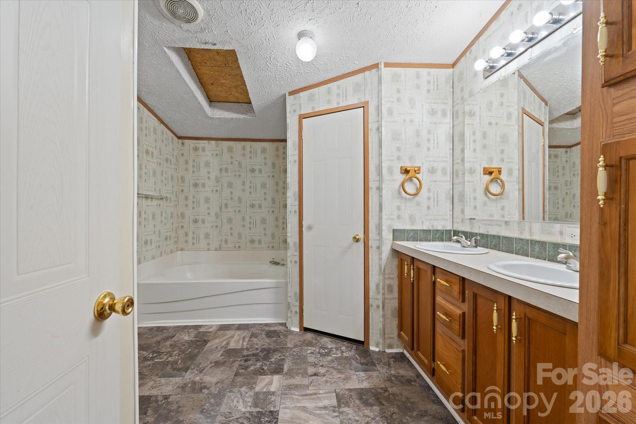 18 Ford Valley Road Weaverville, NC 28787 - Photo 20 of 37 a bathroom with a bathtub and a shower