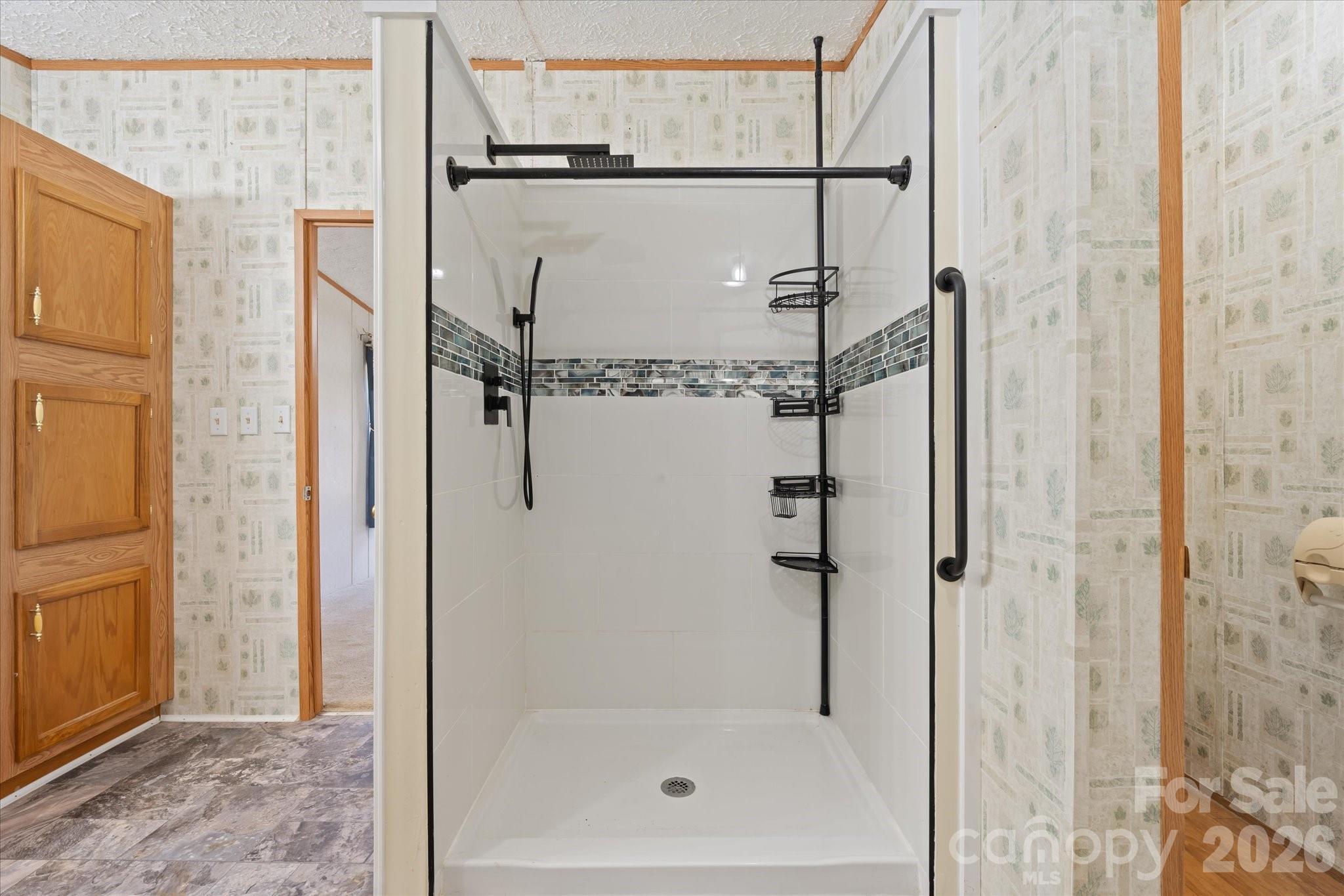 18 Ford Valley Road Weaverville, NC 28787 - Photo 21 of 37 a bathroom with a glass shower door