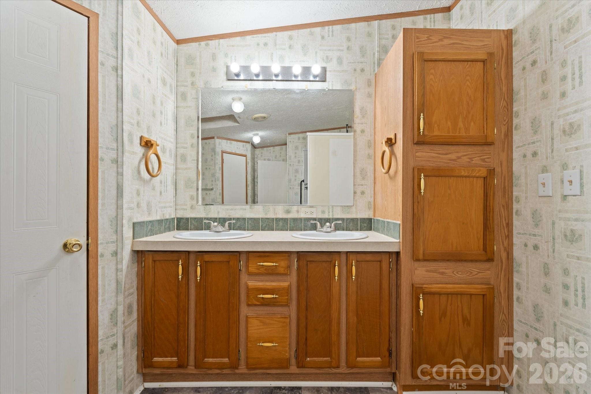 18 Ford Valley Road Weaverville, NC 28787 - Photo 22 of 37 a bathroom with a granite countertop sink and a mirror