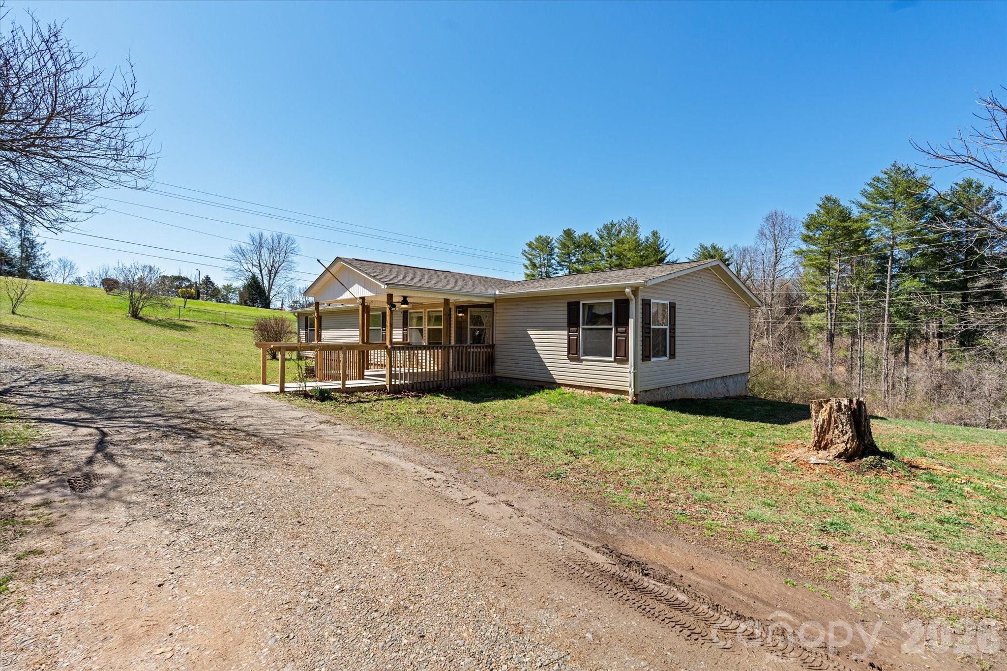 18 Ford Valley Road Weaverville, NC 28787 - Photo 24 of 37 a view of a house with backyard and a tree