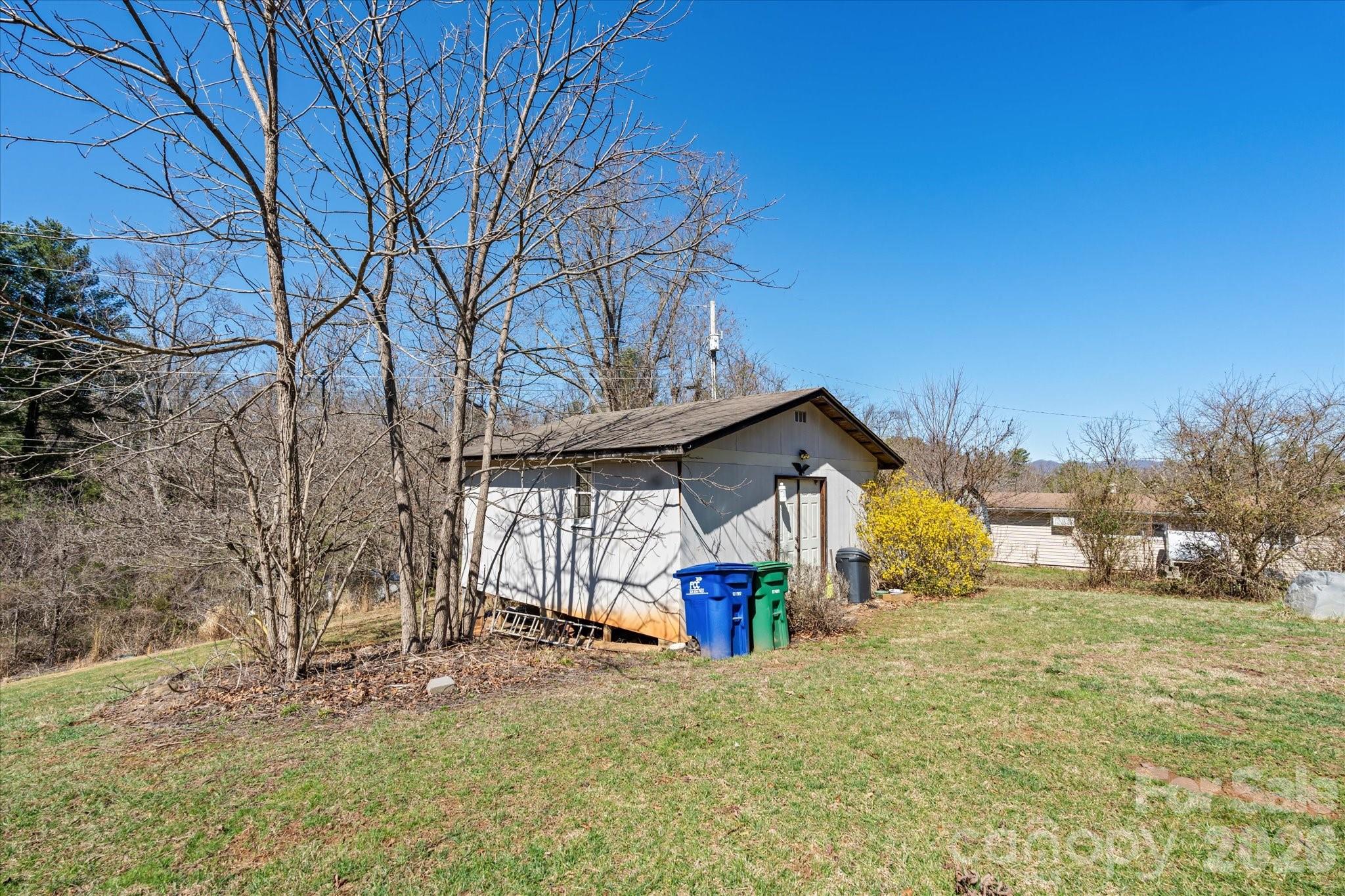 18 Ford Valley Road Weaverville, NC 28787 - Photo 26 of 37 a front view of house with yard and trees in the background