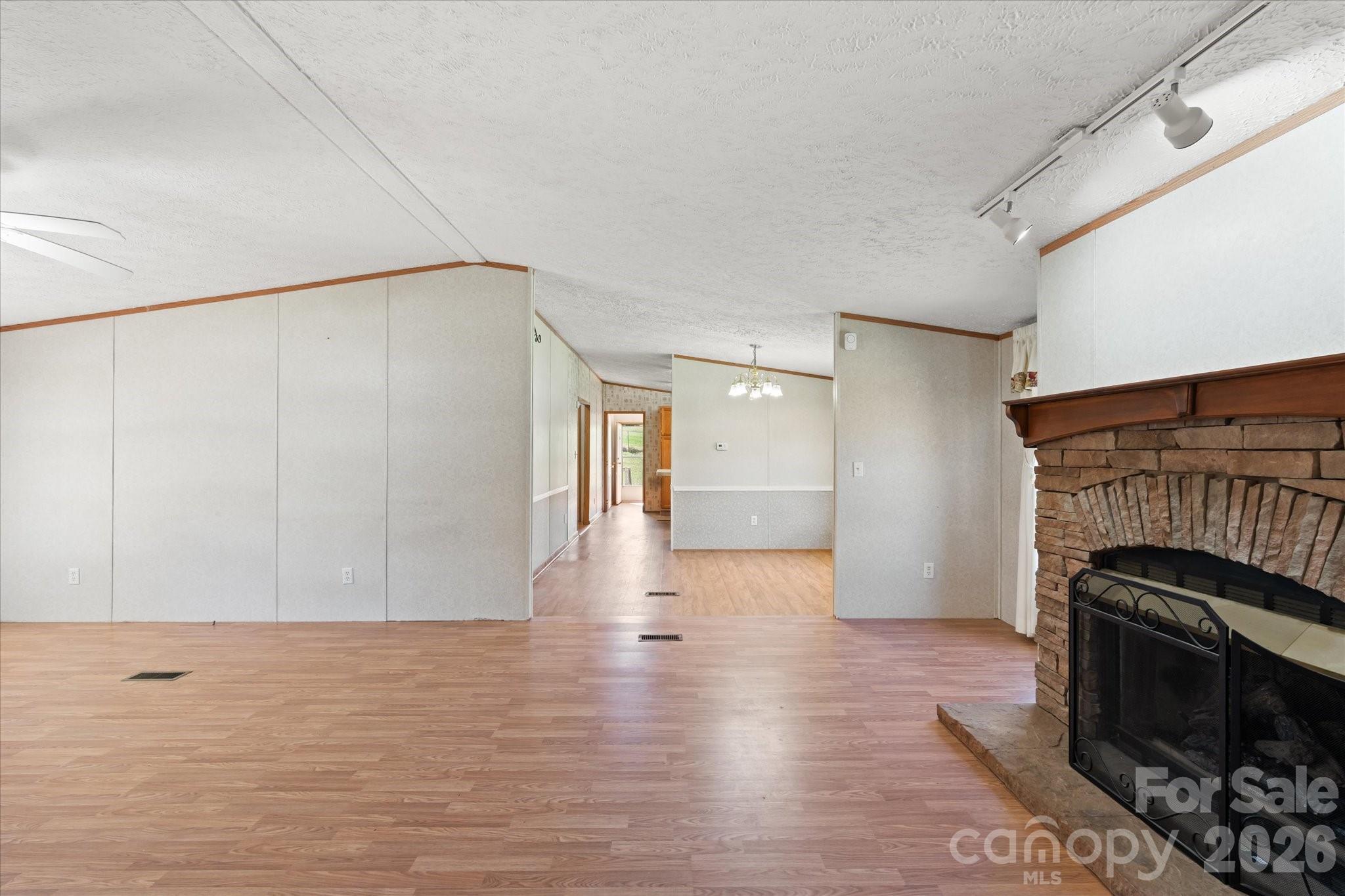 18 Ford Valley Road Weaverville, NC 28787 - Photo 6 of 37 a view of empty room with wooden floor and fan