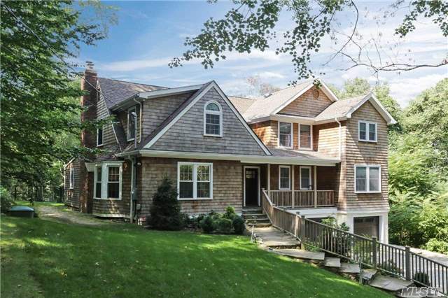 322 Old Mill Road Nissequogue, NY 11780 - Photo 1 of 1 a front view of a house with a garden and porch