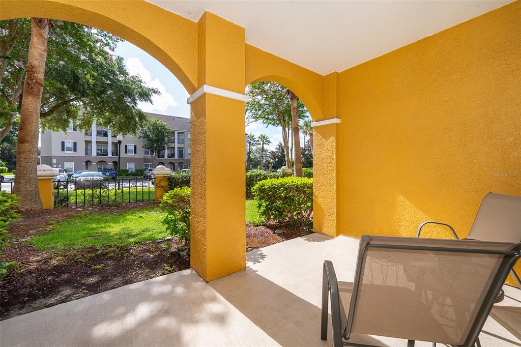 3707 Conroy Road, Unit 1715 Orlando, FL 32839 - Photo 17 of 20 a view of backyard with patio