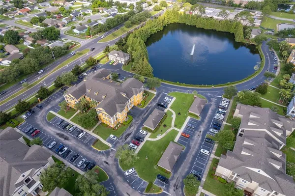 an aerial view of a house with a swimming pool yard and outdoor seating