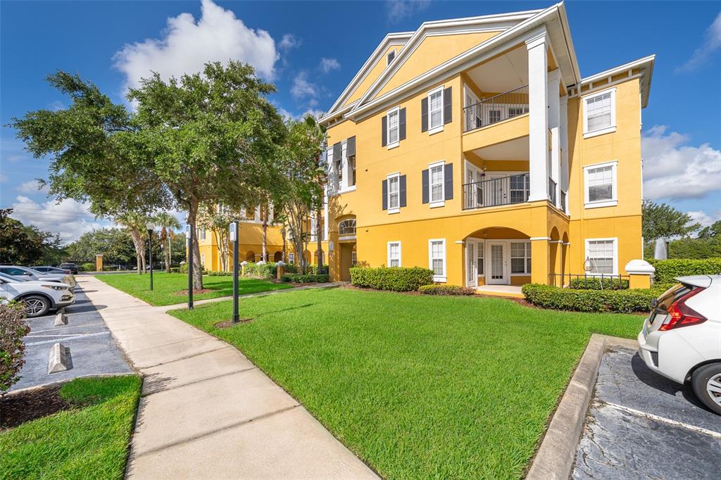 3707 Conroy Road, Unit 1715 Orlando, FL 32839 - Photo 2 of 20 a view of a building with a yard