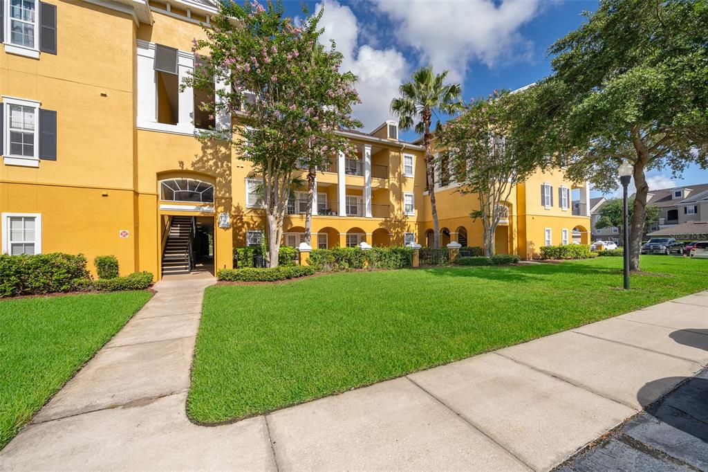 3707 Conroy Road, Unit 1715 Orlando, FL 32839 - Photo 3 of 20 front view of a building with a yard