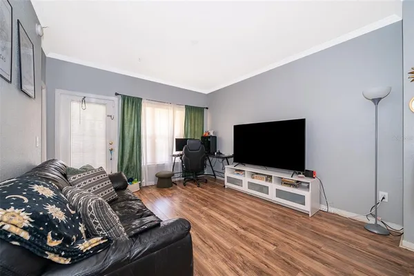a living room with furniture and a flat screen tv