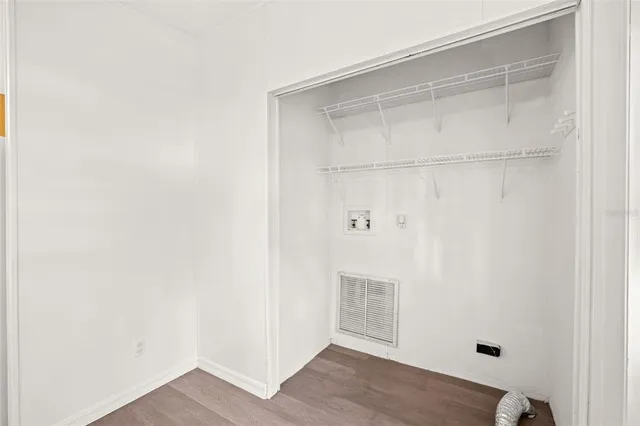 a view of a park with large trees