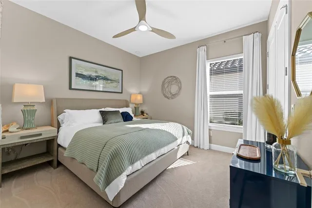 a spacious bedroom with a bed and a window