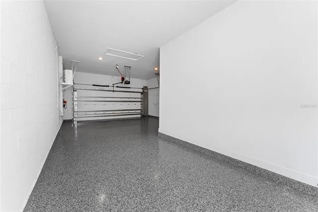 a living room with hard wood flooring and furniture