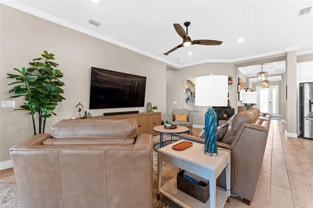 an aerial view of a house with a garden and lake view
