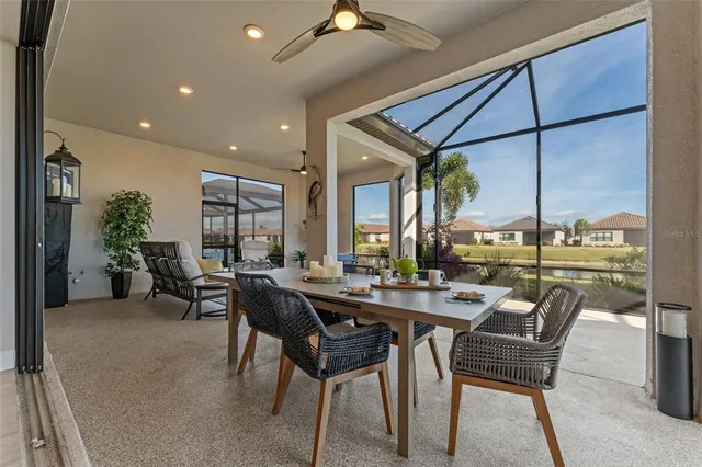 a view of a dining room with furniture window and outside view