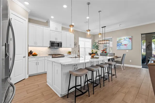 a spacious bedroom with a bed and a window