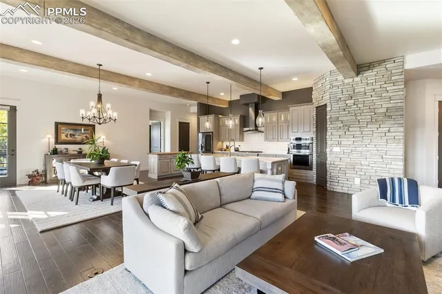 a large kitchen with a table and chairs
