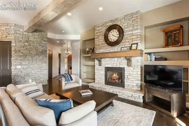 a kitchen with stainless steel appliances granite countertop a refrigerator a sink and a stove