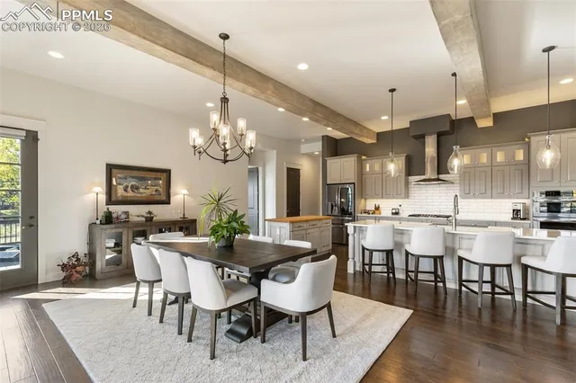 a kitchen with a sink stove and wooden floor