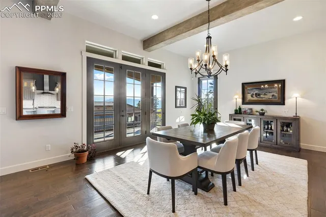 a bedroom with a bed couch and view of living room