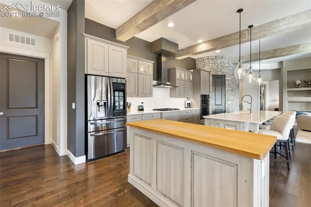 a spacious bathroom with a tub sink and mirror