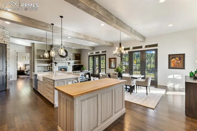 a spacious bathroom with a sink a large mirror and a bathtub next to a window