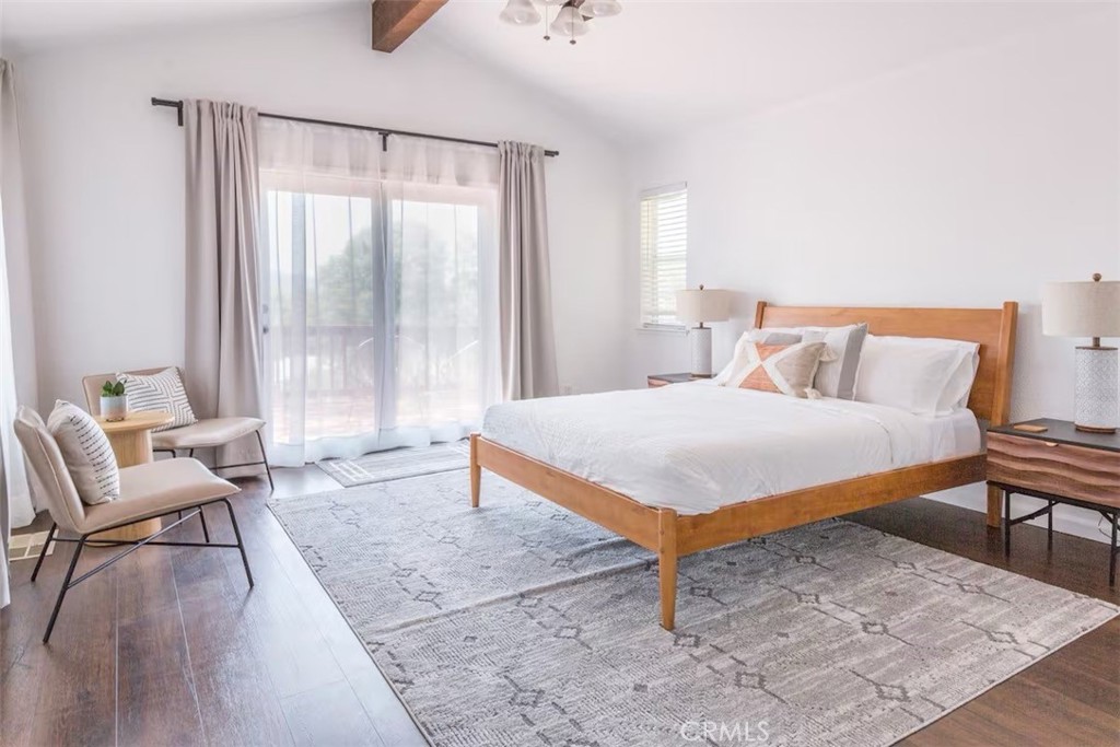 40584 Indian Springs Road Oakhurst, CA 93644 - Photo 11 of 21 a bedroom with a bed and wooden floor