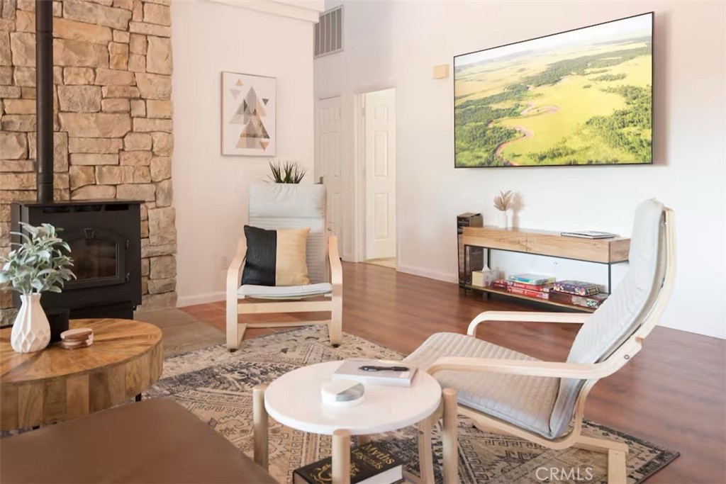 40584 Indian Springs Road Oakhurst, CA 93644 - Photo 3 of 21 a living room with furniture and a fireplace