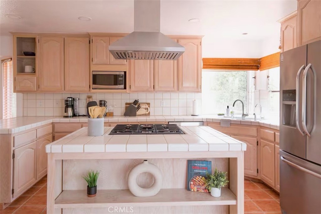 40584 Indian Springs Road Oakhurst, CA 93644 - Photo 5 of 21 a kitchen with a stove a sink and a microwave