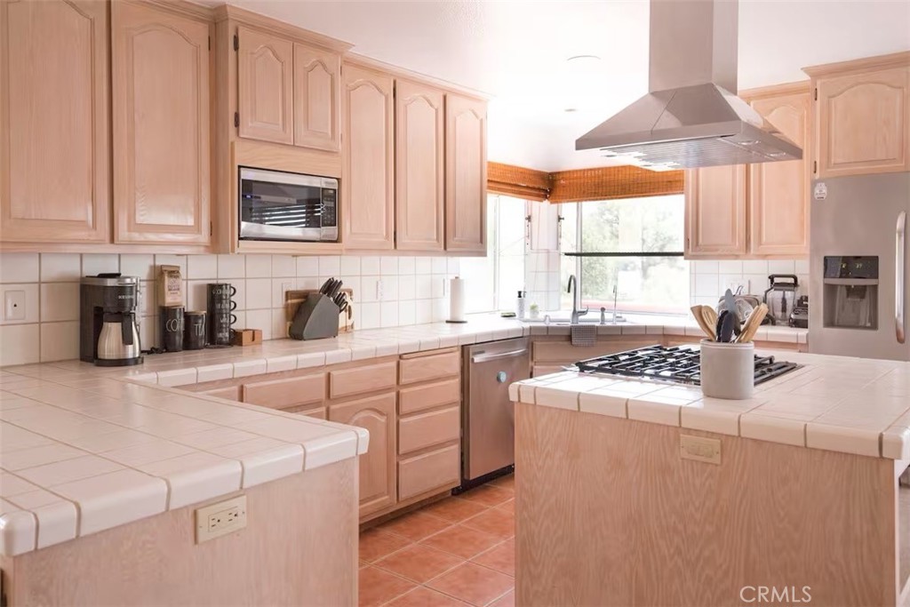 40584 Indian Springs Road Oakhurst, CA 93644 - Photo 6 of 21 a kitchen with cabinets appliances a sink and a window