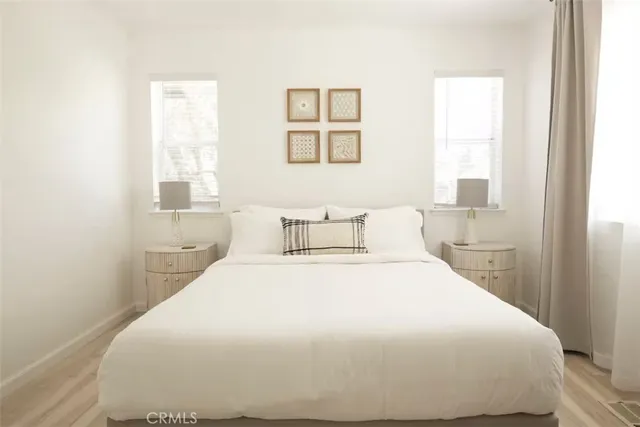 a bedroom with a bed and window